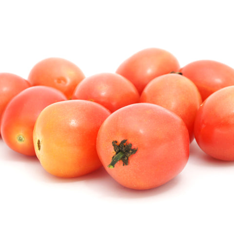 harvested pink thai egg tomatoes on a white background