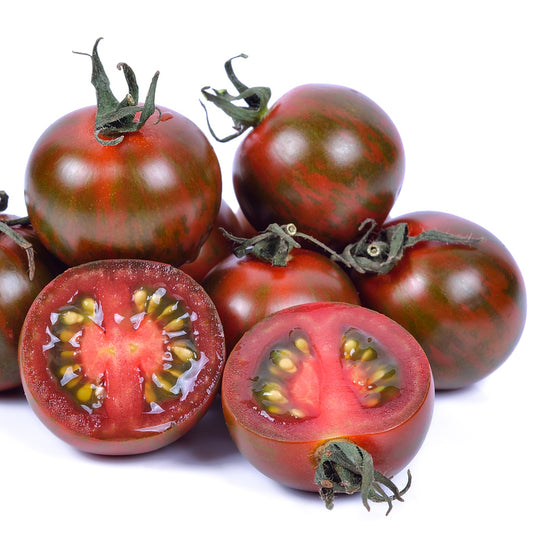 A cluster of dark red cherry tomatoes with one tomato cut in half to show the interior, with visible seeds and flesh.