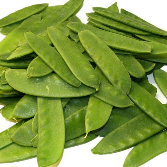 a pile of fresh mangetout peas on a white background