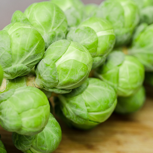 a stalk of brussels sprouts on table